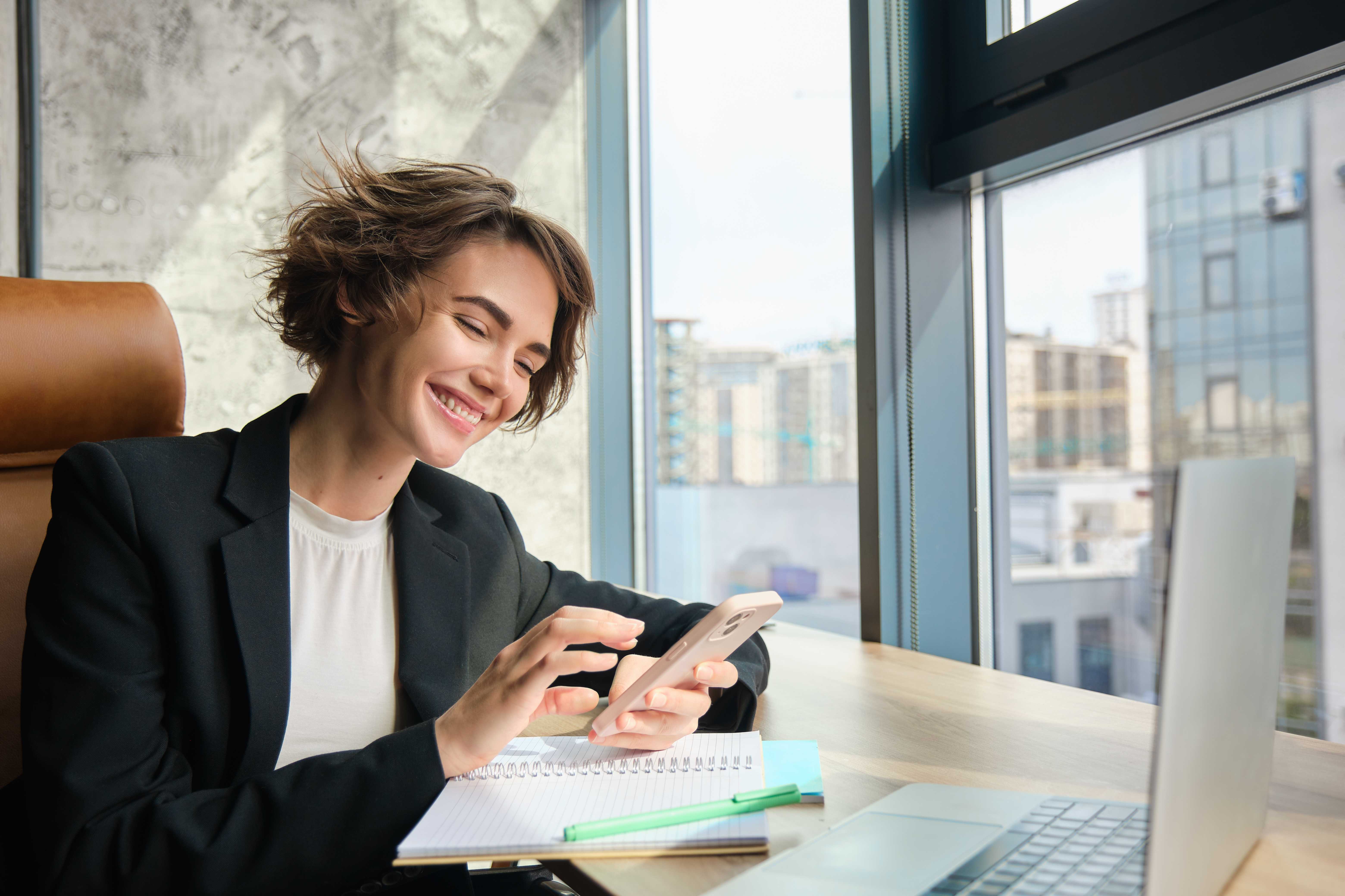 portrait-young-professional-saleswoman-businesswoman-suit-sitting-office-her-company